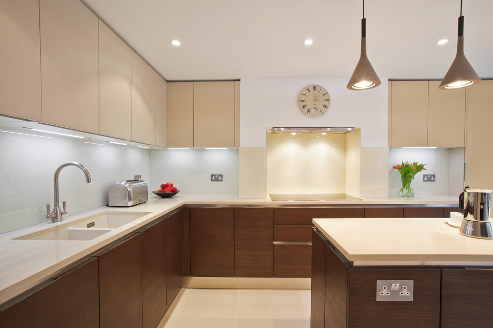 Design ideas for a contemporary l-shaped kitchen in London with a double-bowl sink, flat-panel cabinets, medium wood cabinets and with island.