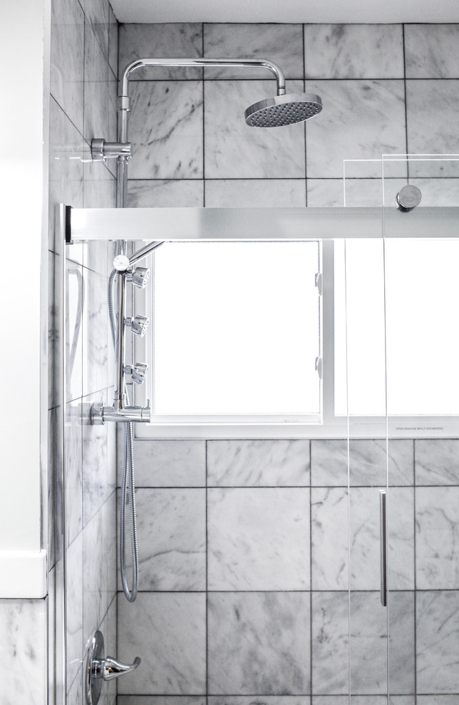Small transitional gray tile and marble tile marble floor and gray floor alcove bathtub photo with furniture-like cabinets, white cabinets, a two-piece toilet, gray walls, a console sink, quartz countertops and white countertops