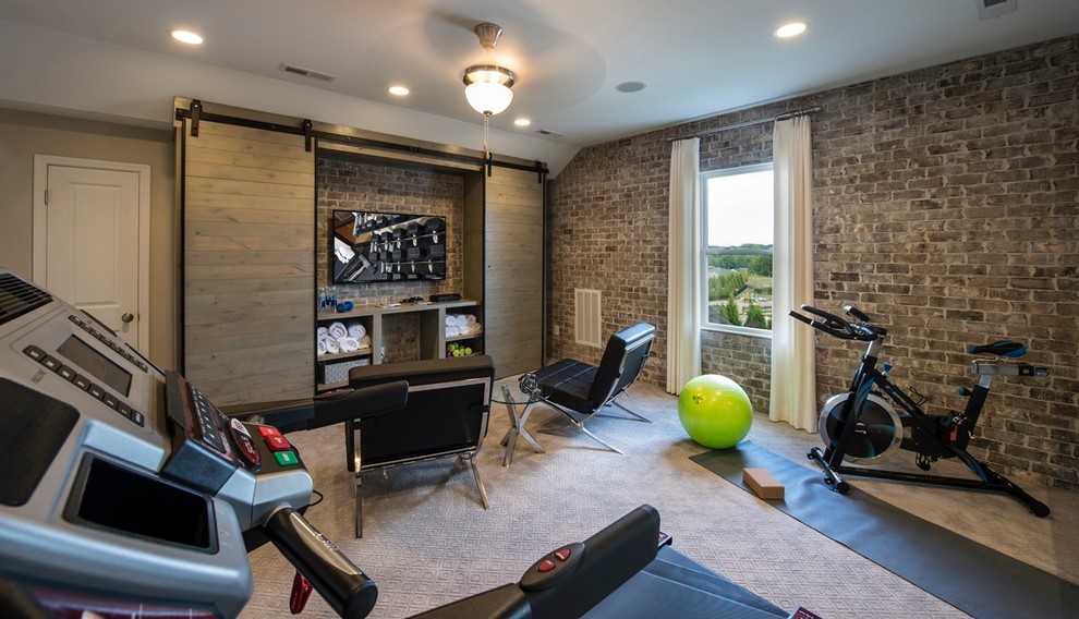This is an example of a transitional home gym in Charlotte.