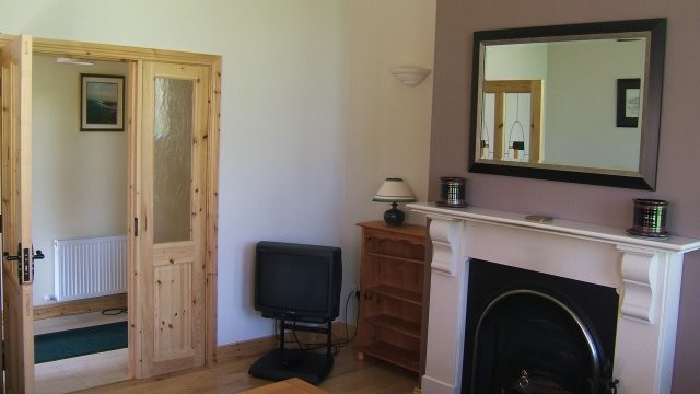 Medium Sized classic Enclosed living room With Purple Walls and Medium Hardwood Flooring.
