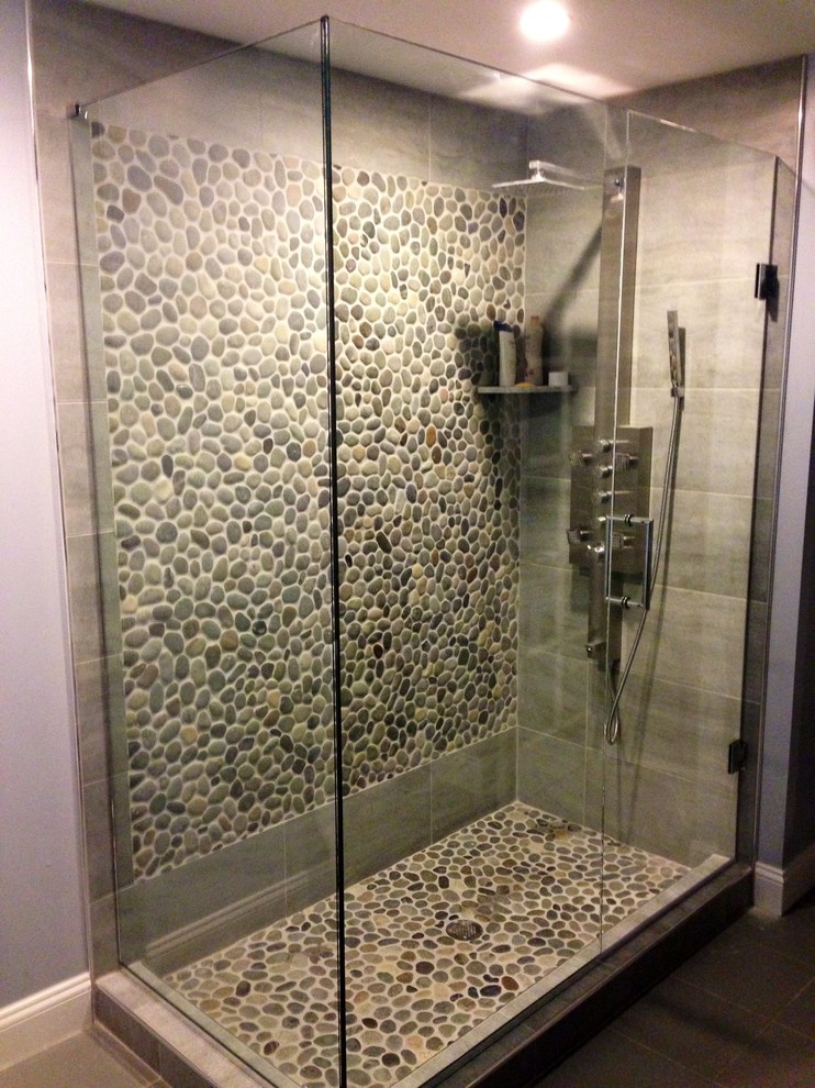Design ideas for a transitional bathroom in Philadelphia with a corner shower, beige tile, gray tile, white tile and pebble tile.
