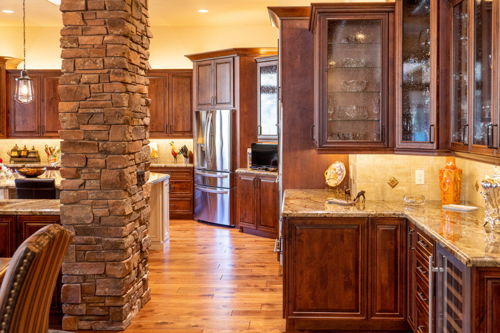 Traditional kitchen in Phoenix with recessed-panel cabinets, distressed cabinets and with island.