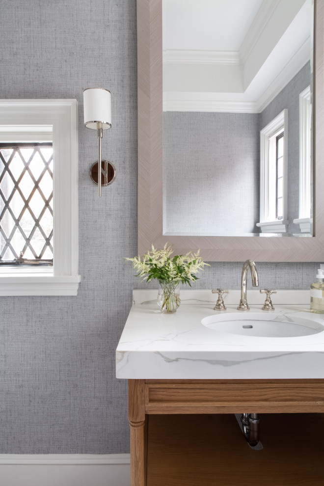 Expansive transitional powder room in New York with marble floors and grey floor.