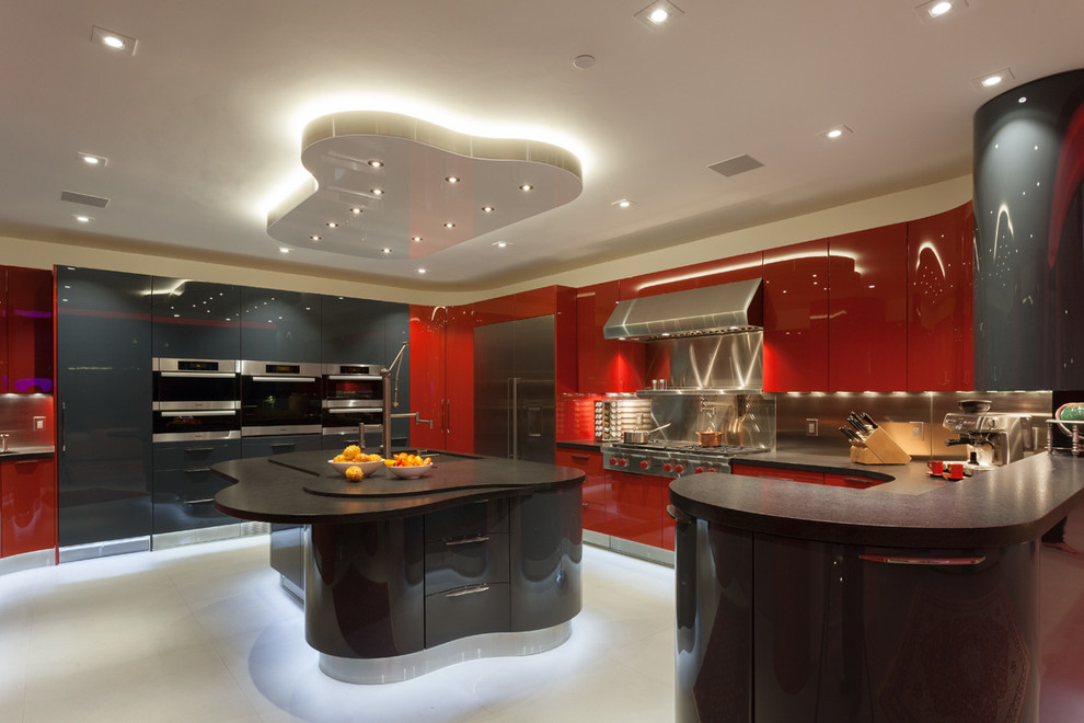 Inspiration for a large modern u-shaped eat-in kitchen in San Francisco with flat-panel cabinets, red cabinets, stainless steel appliances, concrete floors, with island and a double-bowl sink.