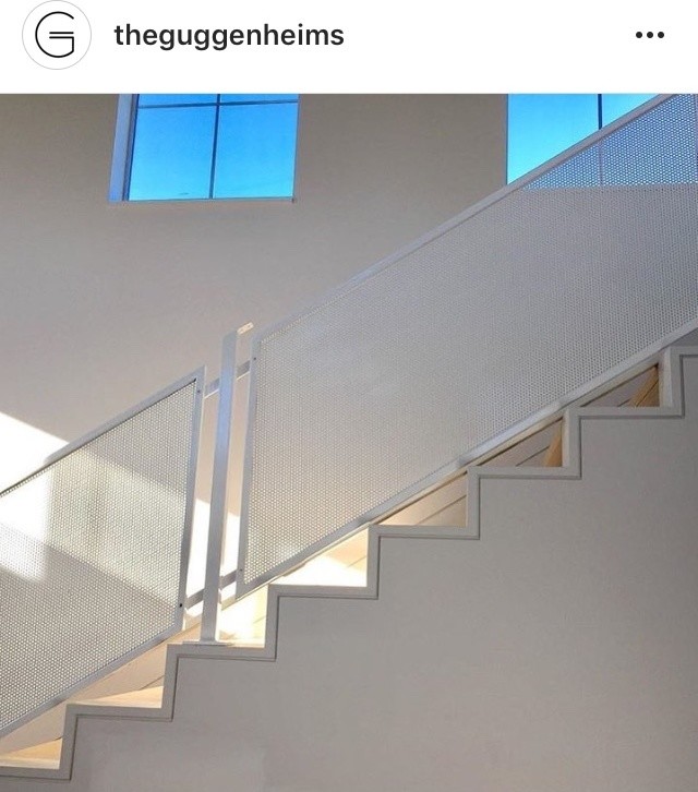 Example of a mid-sized minimalist wooden straight metal railing staircase design in Hawaii with wooden risers
