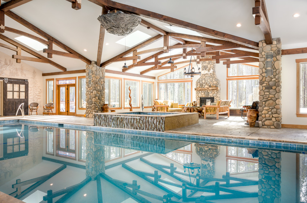 Example of a mid-sized mountain style backyard rectangular lap pool house design