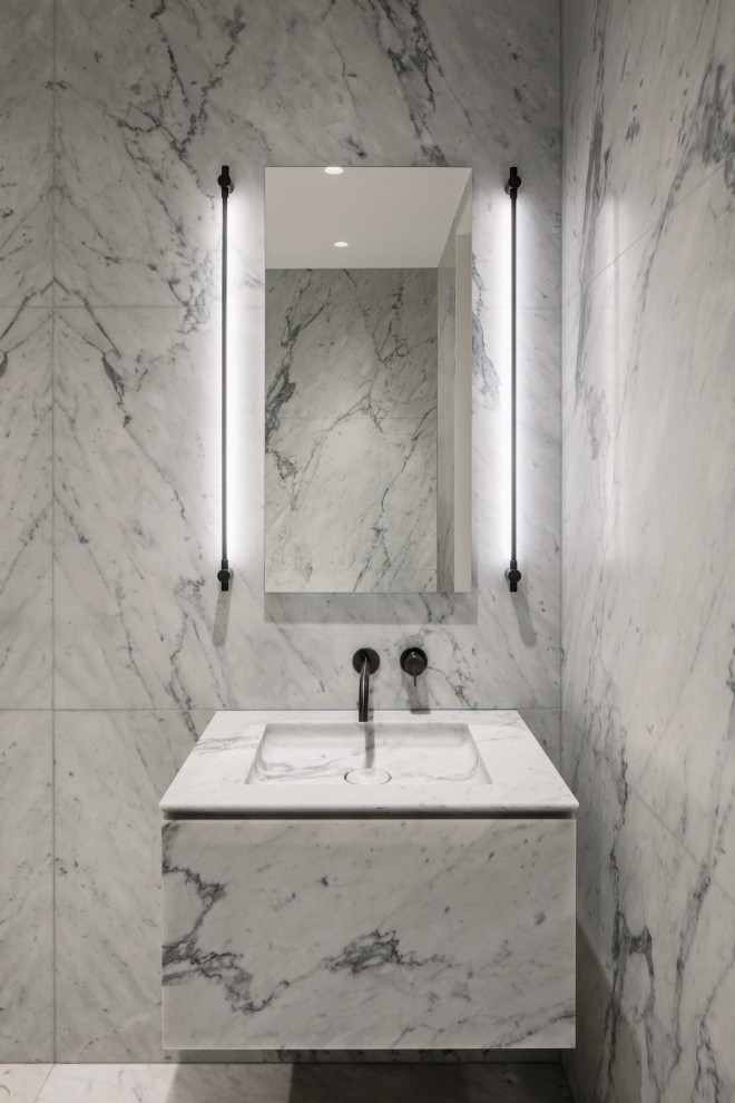 Large modern master bathroom in New York with flat-panel cabinets, grey cabinets, a claw-foot tub, an open shower, a wall-mount toilet, gray tile, stone slab, grey walls, marble floors, an integrated sink, marble benchtops, grey floor, an open shower and grey benchtops.