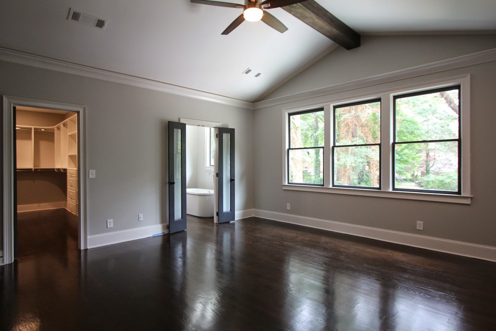 Photo of a mid-sized contemporary master bedroom in Atlanta with grey walls, no fireplace and brown floor.