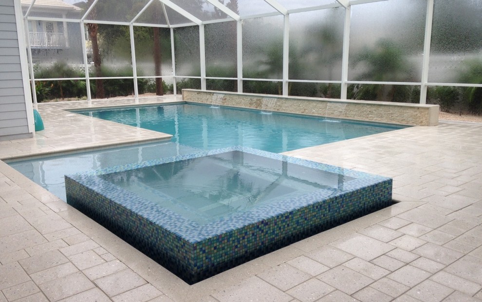 Trendy backyard custom-shaped lap pool fountain photo in Miami