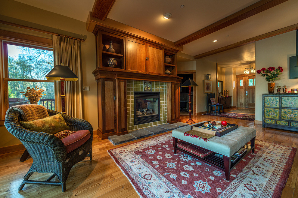 Arts and crafts living room in Seattle with a tile fireplace surround and a standard fireplace.