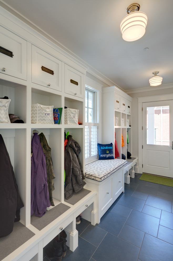 Design ideas for a transitional mudroom in DC Metro with grey walls, a single front door, a white front door and grey floor.