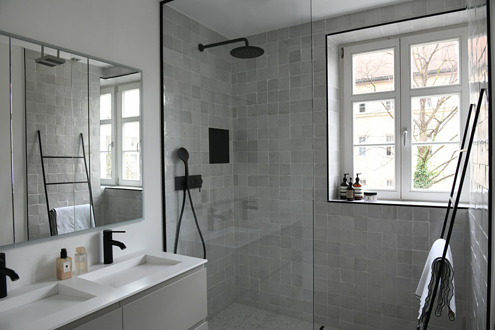 Photo of a small contemporary shower room bathroom in Munich with beige cabinets, a built-in shower, beige tiles, mosaic tiles, white walls, terrazzo flooring, an integrated sink, solid surface worktops, an open shower, white worktops, double sinks and a floating vanity unit.