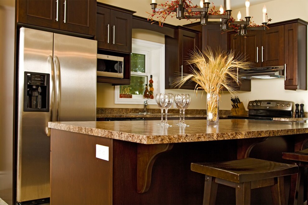 Kitchen - transitional ceramic tile kitchen idea in Toronto with shaker cabinets, medium tone wood cabinets, granite countertops, stainless steel appliances and an island