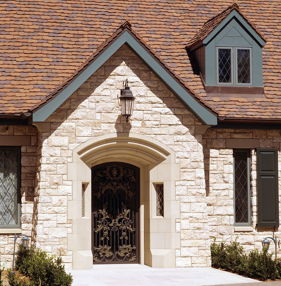 Photo of a traditional exterior in Santa Barbara with stone veneer.
