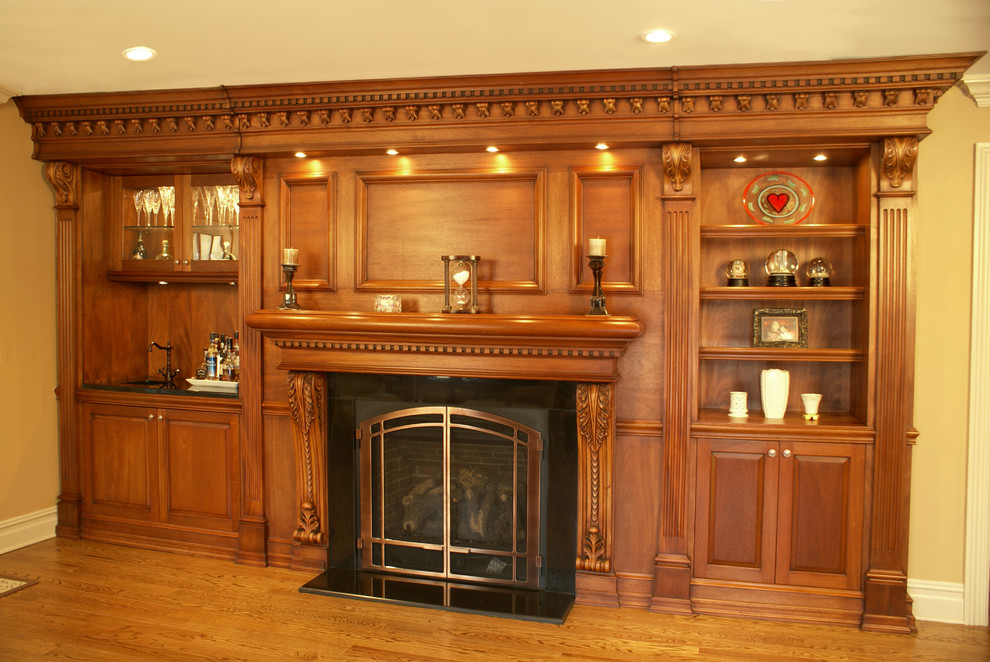 Photo of a large traditional open concept family room in New York with a library, yellow walls, laminate floors, a standard fireplace, a wood fireplace surround, no tv and yellow floor.