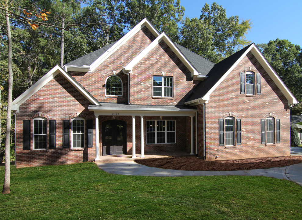 Inspiration for a large traditional home design in Raleigh.