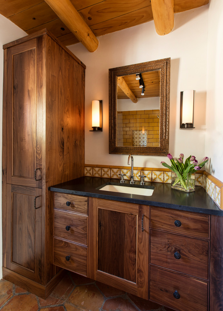 Small tuscan 3/4 yellow tile and subway tile terra-cotta tile doorless shower photo in Albuquerque with shaker cabinets, dark wood cabinets, an undermount sink and quartz countertops