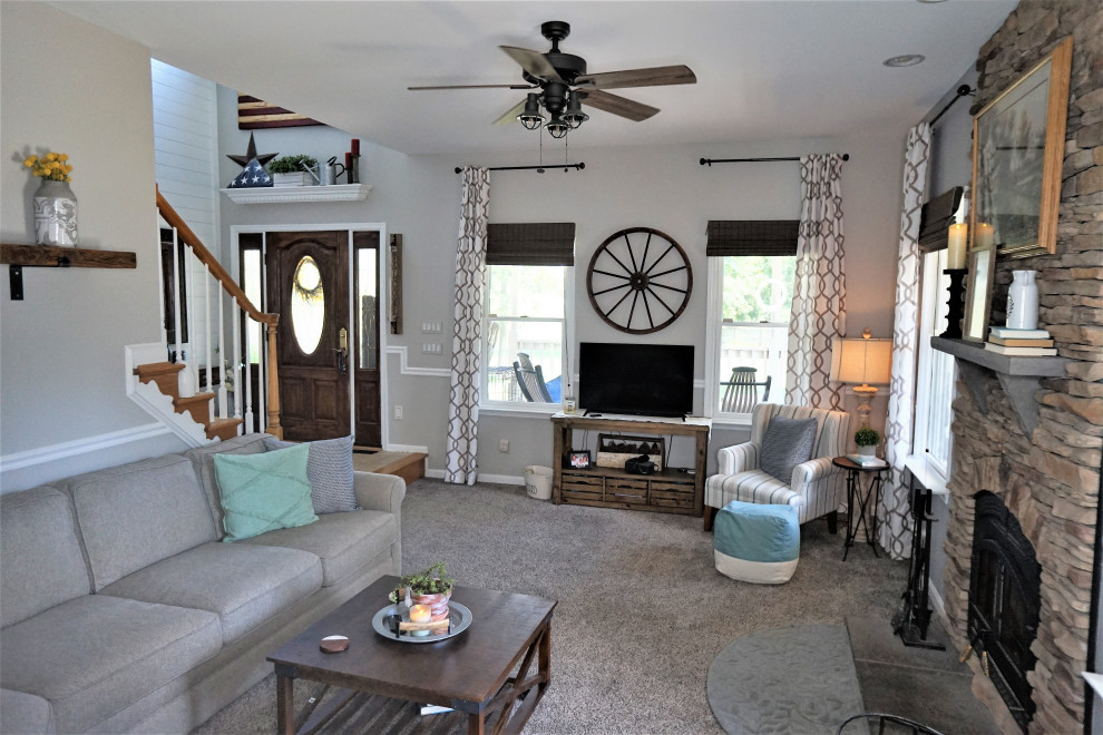 Imagen de sala de estar de estilo de casa de campo de tamaño medio con paredes grises, moqueta y todas las chimeneas