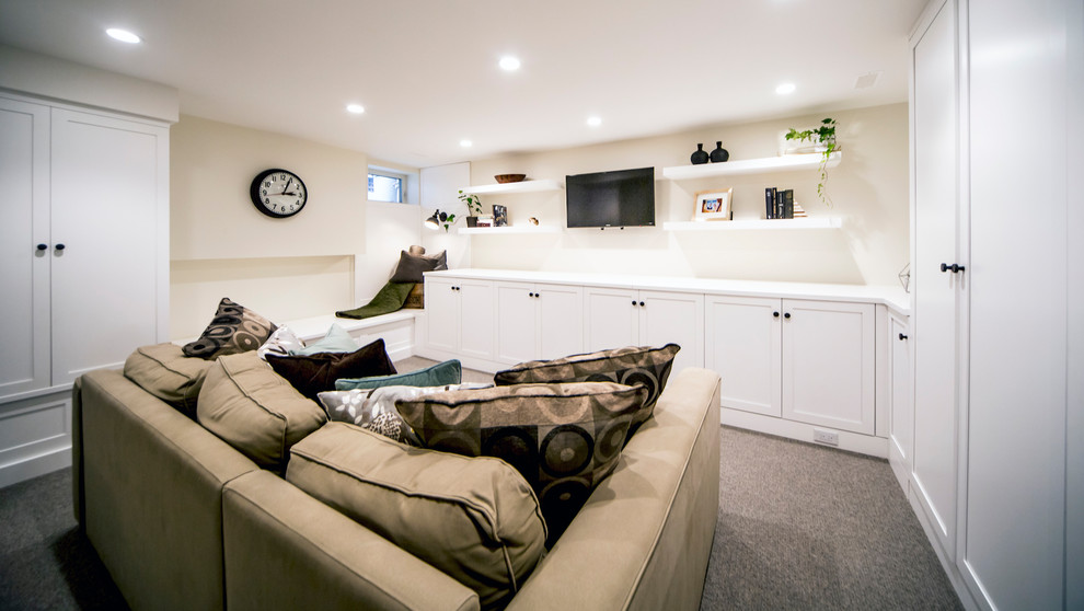 Inspiration for a small transitional look-out carpeted and gray floor basement remodel in Ottawa with beige walls