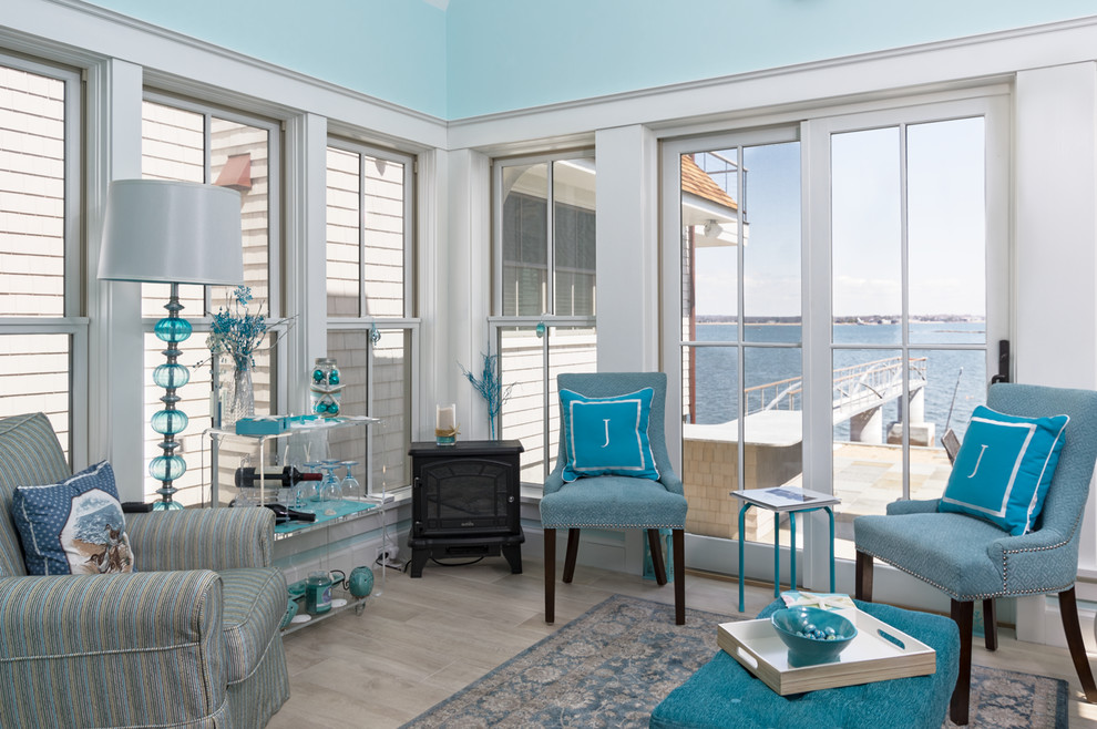 Small beach style sunroom in Bridgeport with porcelain floors, no fireplace, a standard ceiling and beige floor.