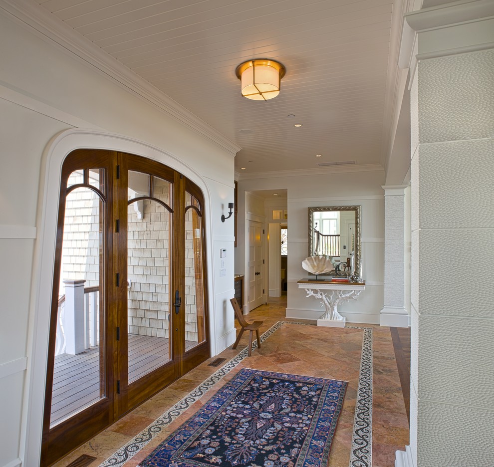 Photo of a beach style entry hall in Philadelphia with a single front door and a glass front door.
