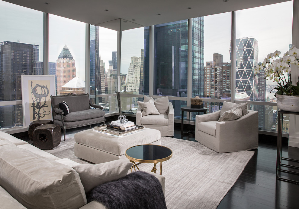 Contemporary open concept living room in New York with dark hardwood floors.
