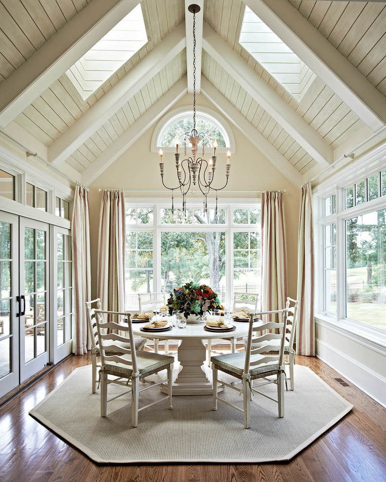 Traditional dining room in Charlotte with beige walls and dark hardwood floors.