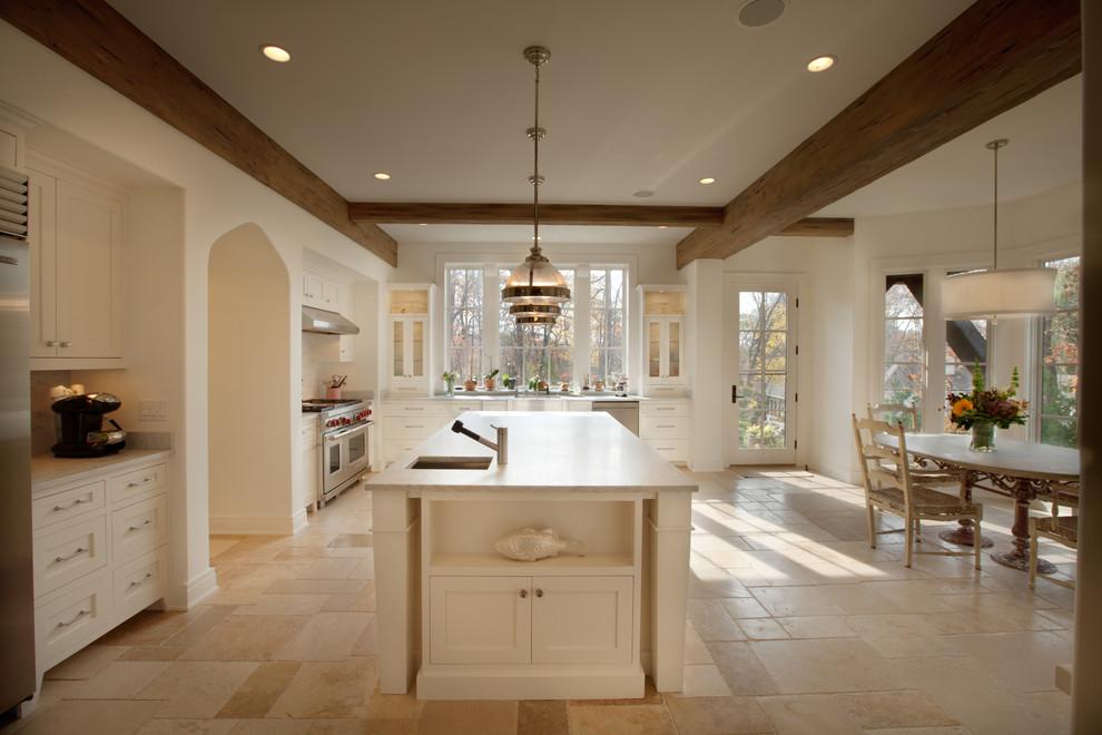 Design ideas for a traditional kitchen in Minneapolis with stainless steel appliances and travertine floors.