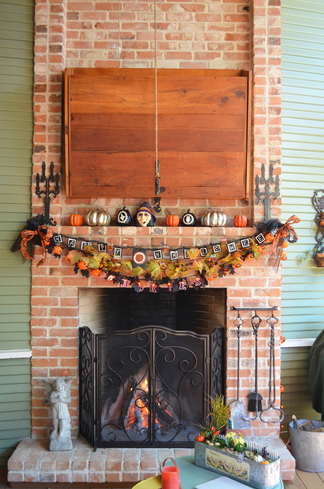 Elegant porch photo in Dallas with a fire pit and decking