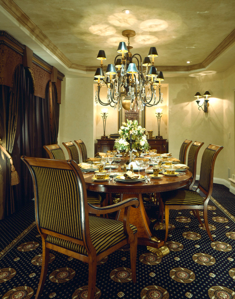 Photo of a traditional separate dining room in Other with beige walls and carpet.