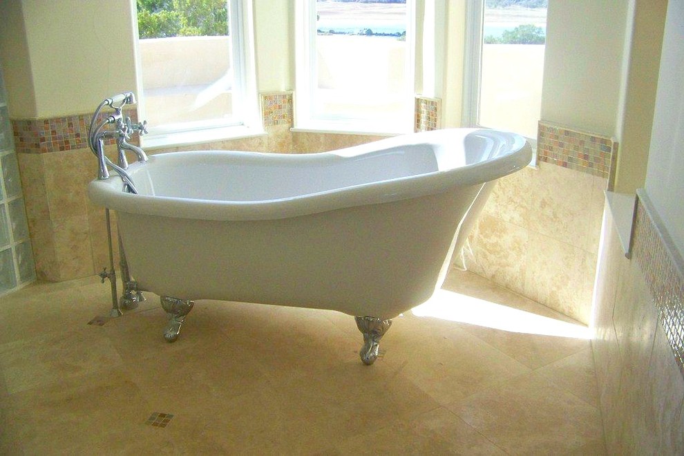 Inspiration for a large transitional master beige tile and ceramic tile ceramic tile and beige floor freestanding bathtub remodel in Austin with beige walls