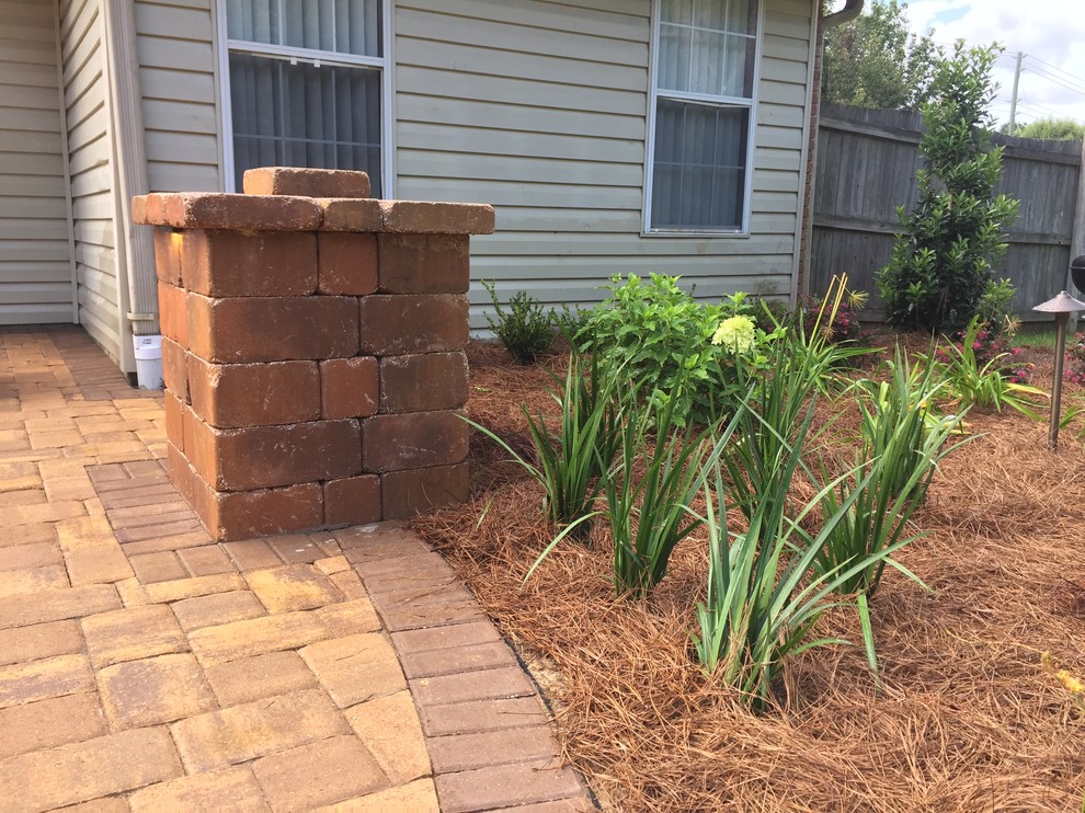 Design ideas for a backyard concrete paver landscaping.