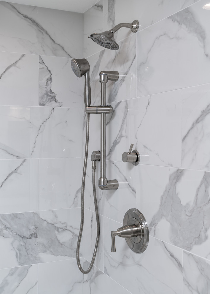 Double shower - large transitional master multicolored tile and mosaic tile porcelain tile double shower idea with gray walls, an undermount sink and quartz countertops