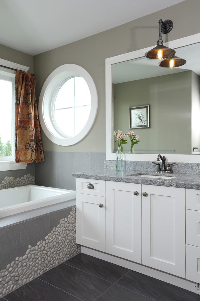 Design ideas for a traditional bathroom in Vancouver with an undermount sink and a drop-in tub.