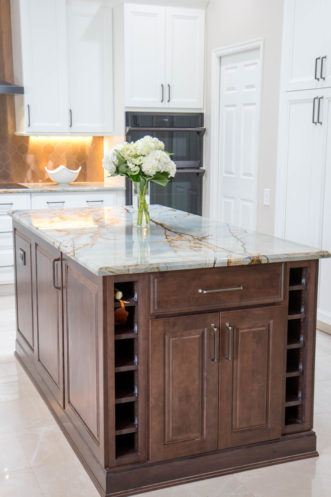 Inspiration for a large transitional u-shaped porcelain tile and beige floor open concept kitchen remodel in Orlando with an undermount sink, raised-panel cabinets, medium tone wood cabinets, granite countertops, metallic backsplash, metal backsplash, black appliances, an island and gray countertops