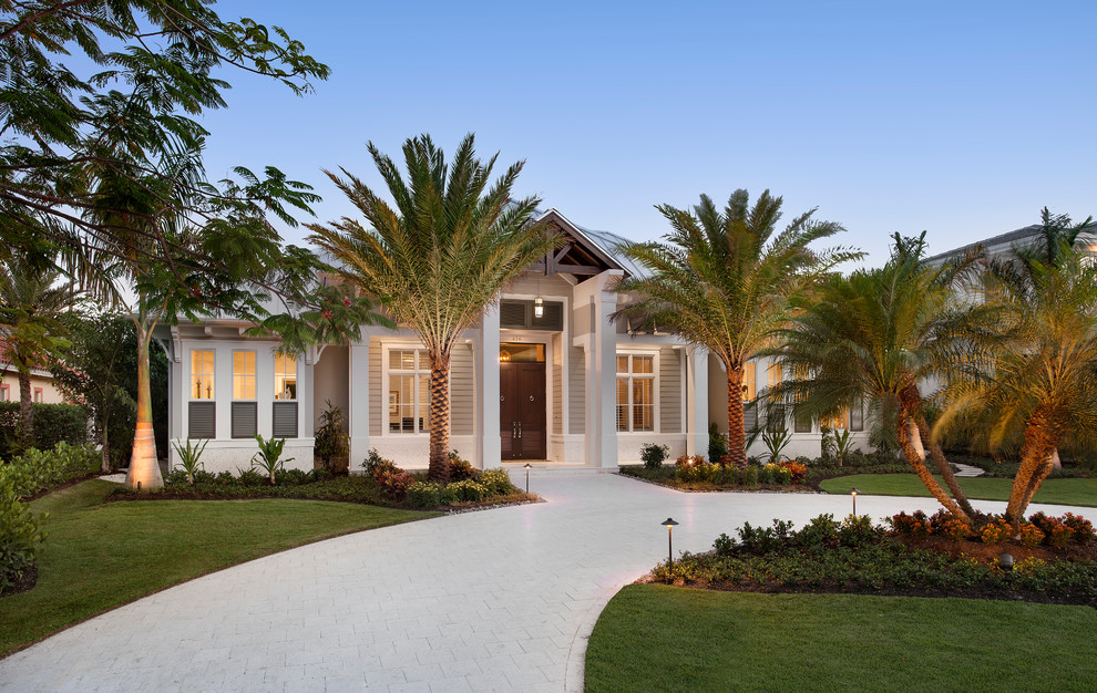 Large transitional brown one-story exterior home idea in Miami