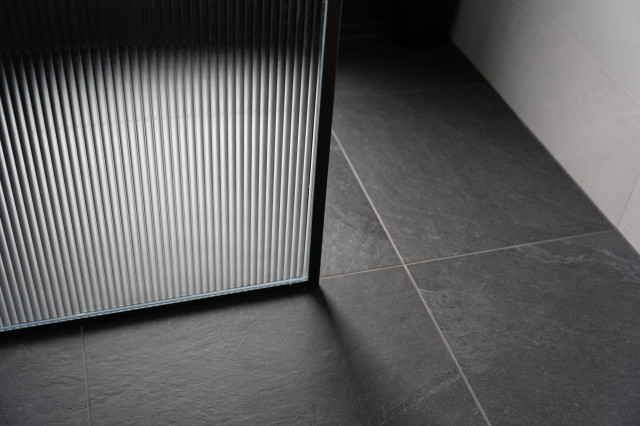 Sophistication in The Heights contemporary-bathroom