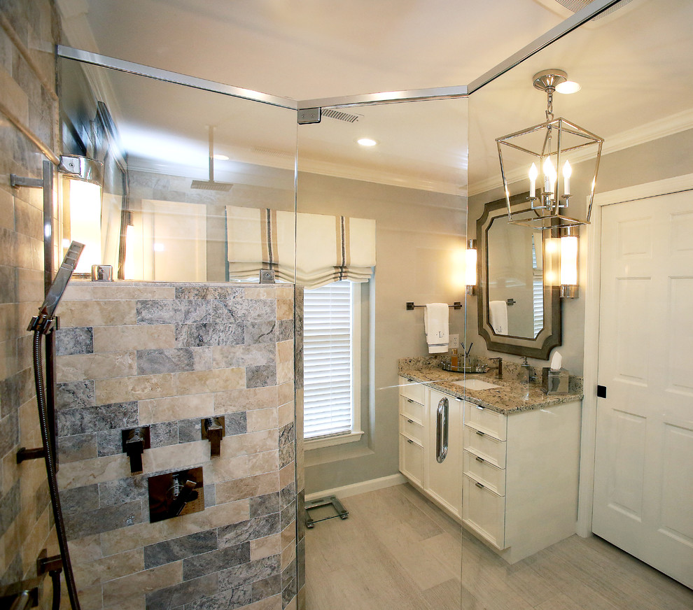 This is an example of a small traditional master bathroom in Other with an undermount sink, recessed-panel cabinets, white cabinets, granite benchtops, a corner shower, a one-piece toilet, gray tile, grey walls and porcelain floors.