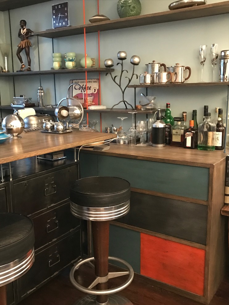 Design ideas for an eclectic home bar in Paris with wood benchtops and medium hardwood floors.