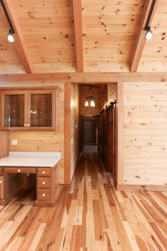 Hallway - rustic light wood floor, yellow floor, wood ceiling and wood wall hallway idea