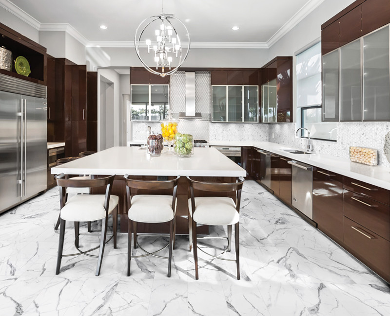 Design ideas for a large contemporary u-shaped kitchen in Calgary with an undermount sink, flat-panel cabinets, brown cabinets, quartzite benchtops, white splashback, glass tile splashback, stainless steel appliances, marble floors, with island and white floor.