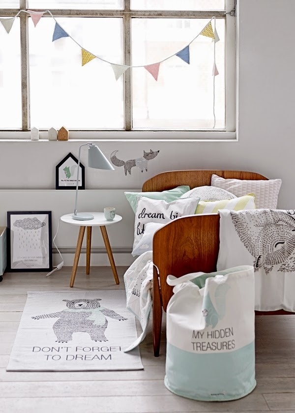 This is an example of a scandinavian gender-neutral kids' bedroom for kids 4-10 years old with white walls.
