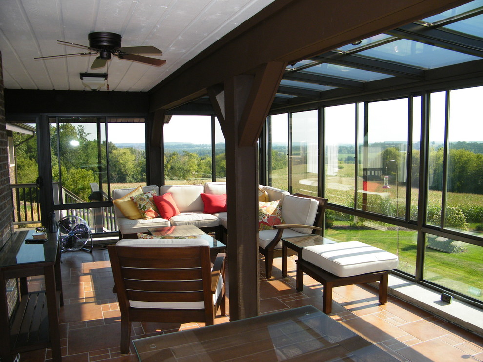 Sunroom - mid-sized transitional terra-cotta tile sunroom idea with no fireplace and a standard ceiling