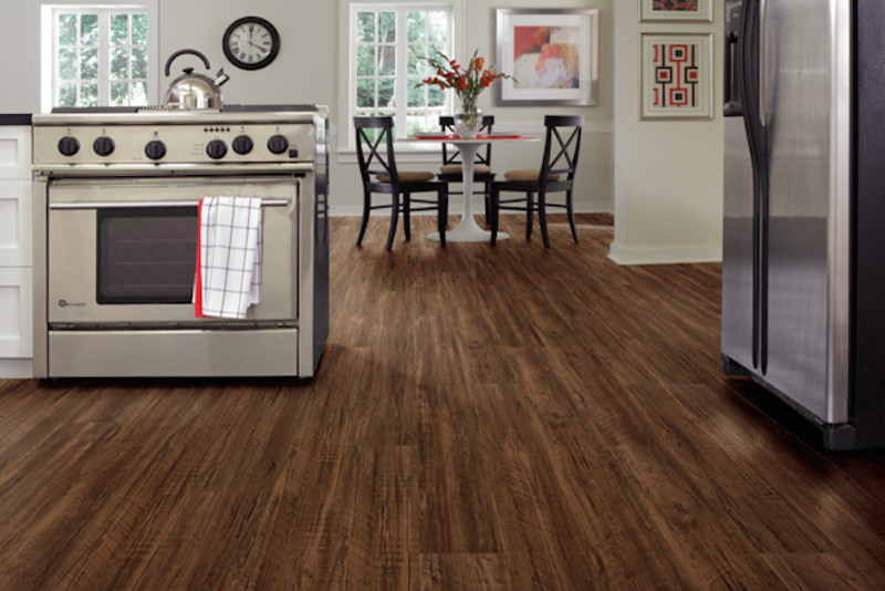 Inspiration for a mid-sized contemporary dark wood floor and brown floor eat-in kitchen remodel in Phoenix with shaker cabinets, white cabinets, granite countertops, stainless steel appliances and a peninsula