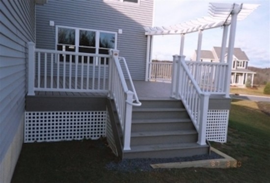 Backyard deck photo in Boston with an awning