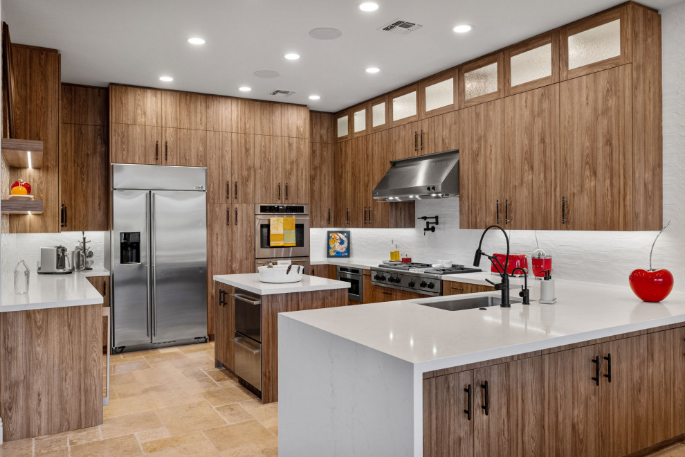 Enclosed kitchen - rustic l-shaped slate floor and beige floor enclosed kitchen idea with a single-bowl sink, flat-panel cabinets, medium tone wood cabinets, quartzite countertops, white backsplash, glass sheet backsplash, stainless steel appliances, a peninsula and white countertops