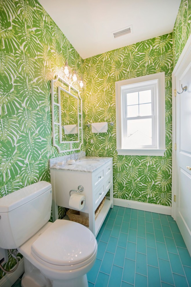 Beach style powder room in Other with shaker cabinets, white cabinets, a two-piece toilet, green walls, an undermount sink, marble benchtops, turquoise floor and grey benchtops.