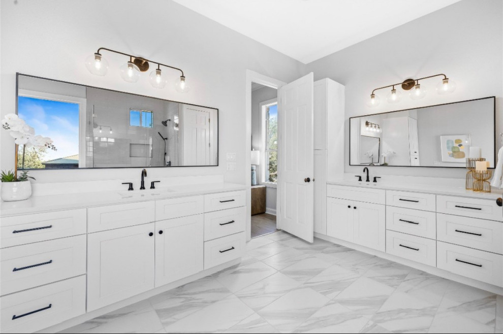 This is an example of a medium sized midcentury ensuite bathroom in Austin with shaker cabinets, white cabinets, a freestanding bath, a corner shower, grey tiles, cement tiles, multi-coloured walls, porcelain flooring, a submerged sink, engineered stone worktops, multi-coloured floors, a hinged door, white worktops, a shower bench, double sinks and a built in vanity unit.