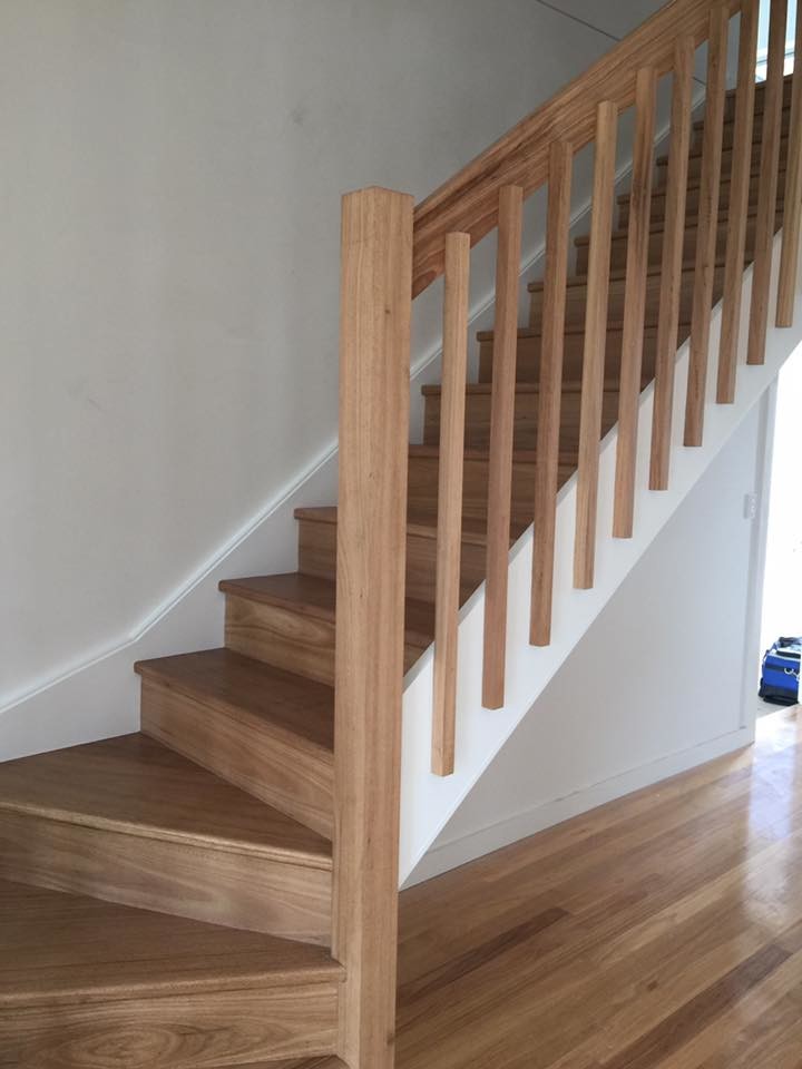 Mid-sized contemporary wood l-shaped staircase in Sydney with wood risers.