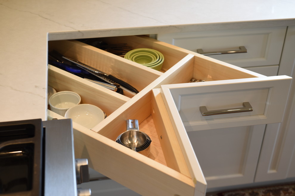 Inspiration for a transitional ceramic tile kitchen remodel in Seattle with shaker cabinets, white cabinets, quartzite countertops, subway tile backsplash, stainless steel appliances, an island and white countertops